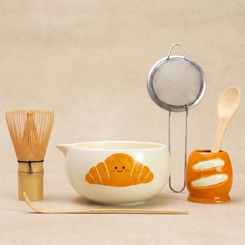 KOIMYSA Cute Matcha Set, 6PCS Matcha Kit with Ceramic Pouring Bowl, Bamboo Whisk, Scoop, Spoon, Stainless Steel Sifter & Whisk Holder, Whimsy Matcha Gift Set for Beginners, Smiling Croissant Bowl - Image 1