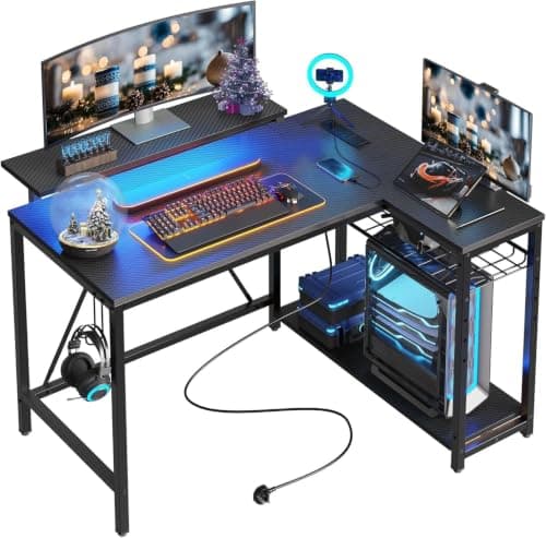 Bestier Gaming Desk with Power Outlets, 42" L-Shaped Computer Desk with LED Lights, Desk with Reversible Storage Shelves & Hooks for Small Spaces, Bedrooms & Offices, Black Carbon Fiber - Image 1